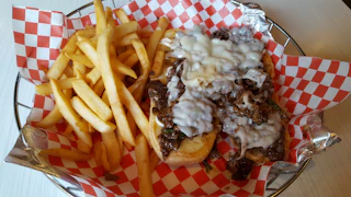 steak sandwich and fries