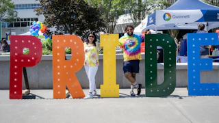 Large Pride letters in rainbow colors