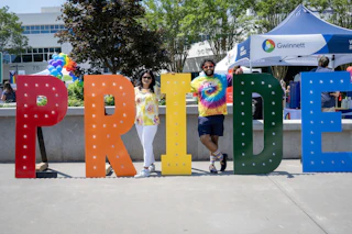 Large Pride letters in rainbow colors