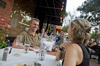 couple at table laughing