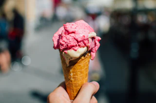person holding an ice cream cone