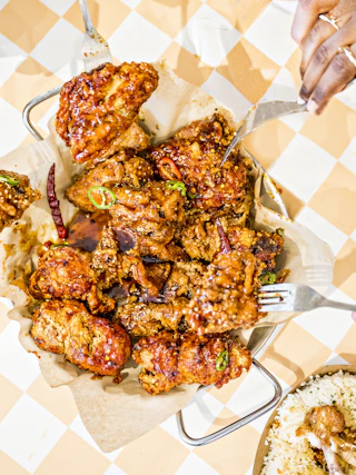 plate of food on a table being shared by several people